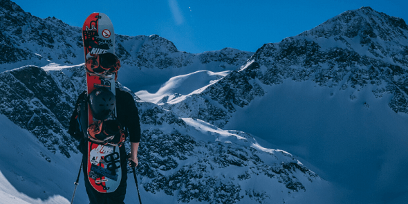 guy with snowboard dressed with base layer