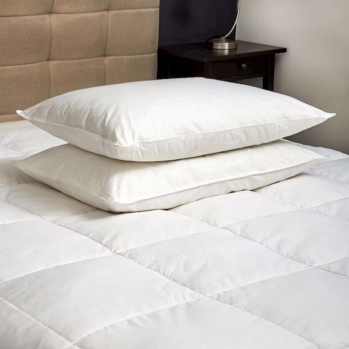 pillows above mattress cover