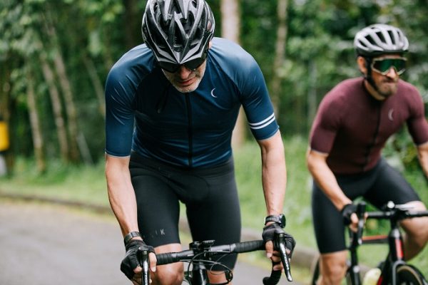 2 men riding a bike