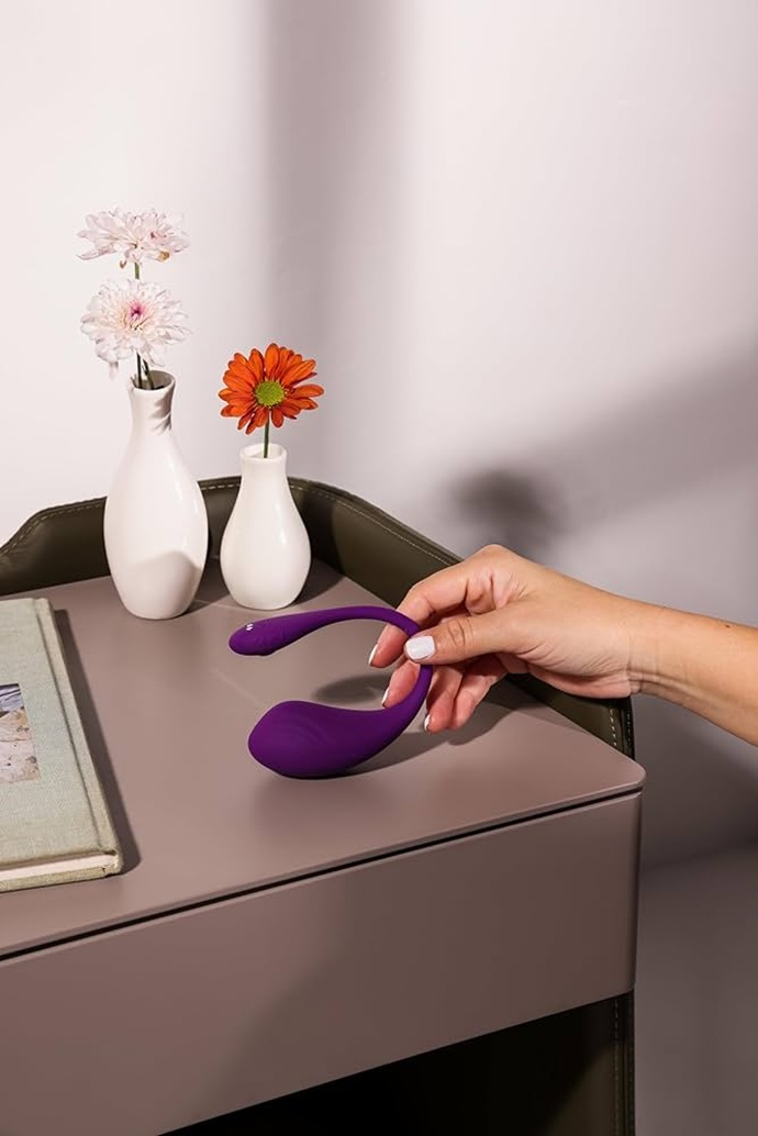 woman picking up the clitoral vibrator